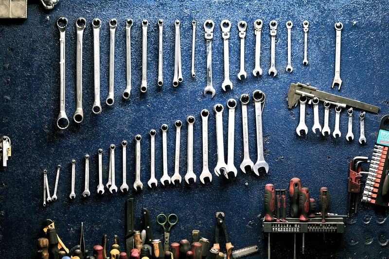Wrenches from an automotive shop lined up on a backdrop - corporate transparency act